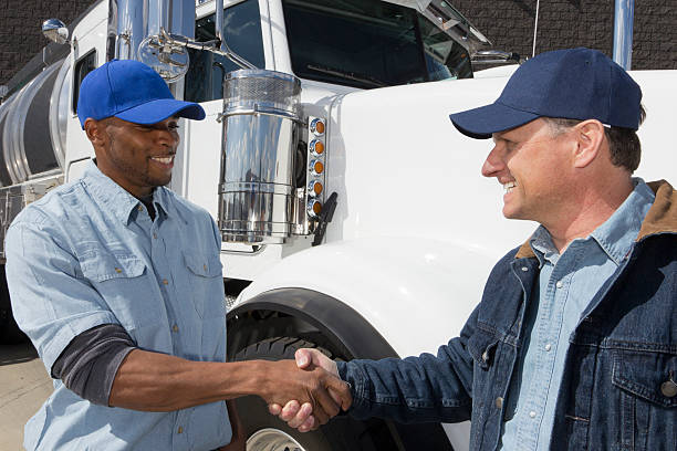 blue collar workers shaking hands