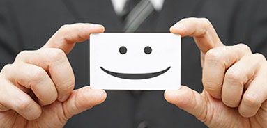 smiling face on a business card