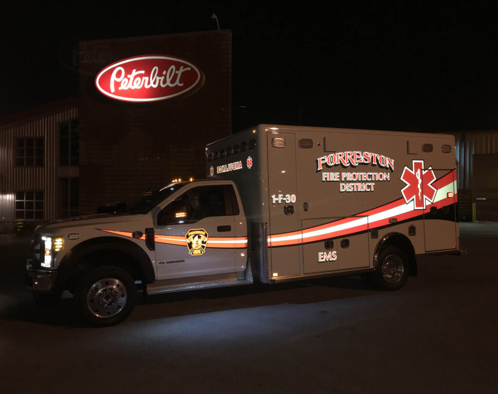 forreston fire dept ambulance with glowing text and images for high nighttime visibility