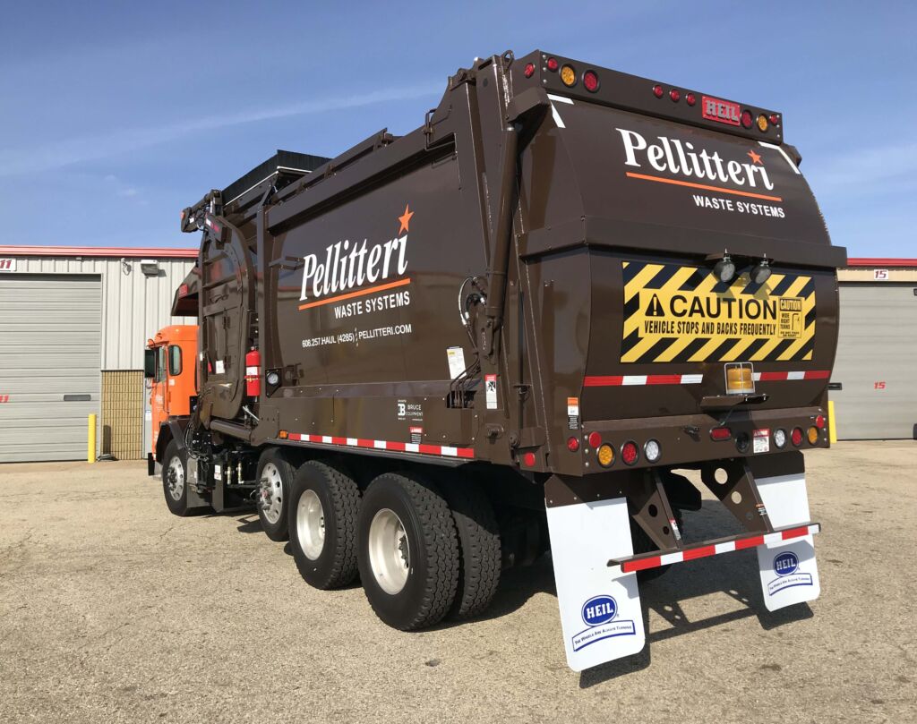 pellitteri waste systems truck graphic with caution warning on back
