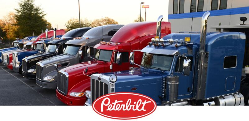 trucks lined up with the peterbilt logo
