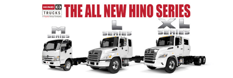 The new Hino truck models, M series, L series, XL series lined up. White Hino trucks.