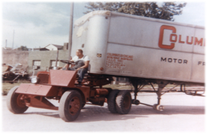 image of old kalmar ottawa terminal tractor moving a trailer
